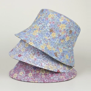 Women's reversible floral bucket hats in blue, yellow and pink cotton sun protection