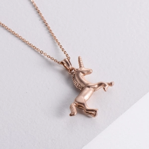 Polished rose gold unicorn pendant necklace crafted in stainless steel with a sandblasted finish