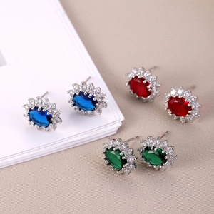 Detailed macro view of colorful oval gemstones with sparkling sunflower zircon halos