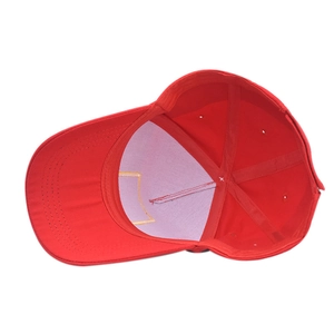 Internal view of red Christmas baseball cap showing white lining and reinforced stitching