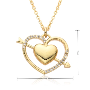 Detail shot of heart and arrow gold pendant with white zircon stones and 19x26mm dimensions