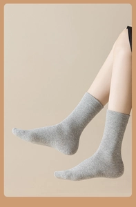 Close-up of heather grey combed cotton crew socks showing soft knit texture and elastic cuff