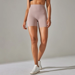 Macro shot of high-waist mauve yoga shorts showing seamless brushed fabric texture