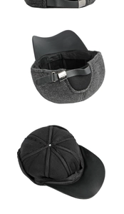 Detail of winter baseball cap showing wool fabric, leather brim, and adjustable strap
