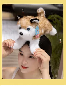 Close-up of a realistic husky plush toy with blue eyes and authentic brand tag