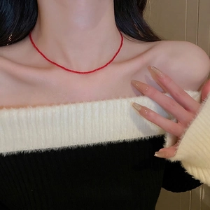Elegant red faceted crystal bead choker necklace shown on model's neck for a stylish look