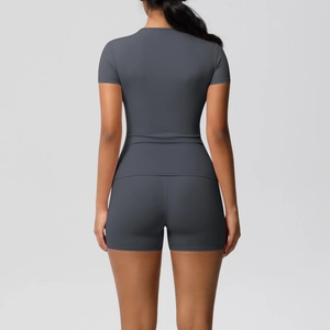 Rear view of tight dark gray yoga set featuring high-stretch brushed fabric texture