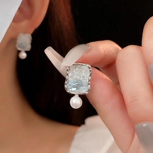 Elegant silver earrings with light blue crystal stone and white pearl dangle drop