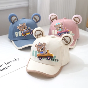 Cartoon car bear baseball caps for toddlers in blue, pink, and beige cotton fabric