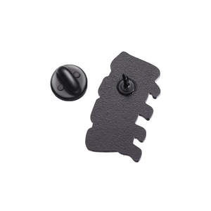 Macro shot of bone shaped badge back featuring black matte finish and secure rubber clutch