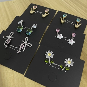 Detailed set of six diverse luxury earrings including tulip, floral and gemstone designs