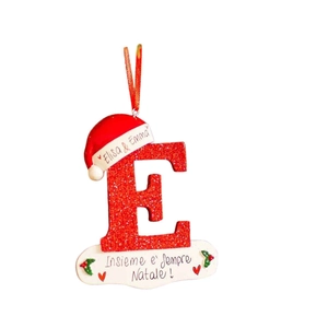 Detail of red glitter letter E Christmas ornament with Santa hat and Italian inscription