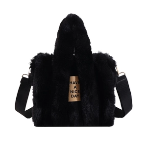 Fuzzy black plush tote bag with Have a Nice Day patch on a clean white background