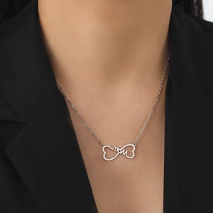 Silver infinity Mom necklace pendant on neck with black blazer for Mother's Day gift