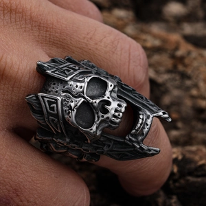 Vintage silver skull ring with ornate engravings on stainless steel punk band