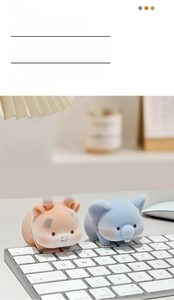 Furry flocking cartoon animal figurines on a keyboard for monitor and desk decoration
