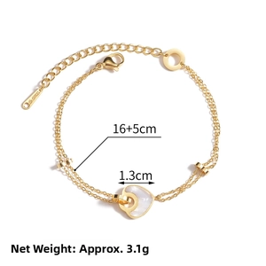 Detail of 14K gold-plated double-layer bracelet with heart pendant and lobster clasp