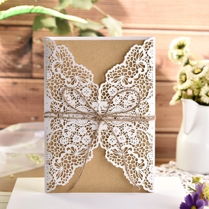Laser cut lace wedding invitation with kraft paper insert and rustic twine decoration