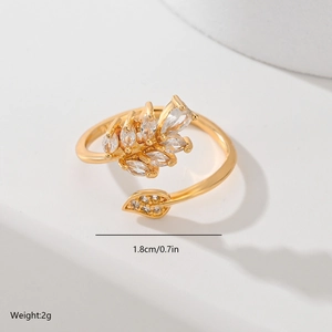 Macro shot of gold-plated leaf ring with zircon stones including size 1.8cm and weight 2g