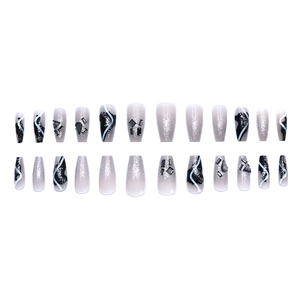 Black and silver press-on nails set with rhinestones and glitter in coffin shape