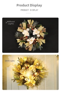 Detail of Christmas wreath with golden pinecones, white flowers and warm LED lights