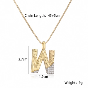 Detail of golden letter W necklace with zircon accents including size and weight specs