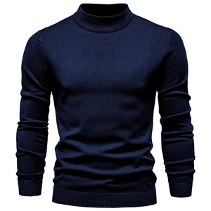 Detailed view of dark blue ribbed turtleneck sweater with slim fit knit texture