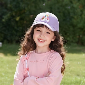 Cute purple cotton unicorn baseball cap for girls worn by a child outdoors