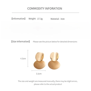 Size details of oval brushed metal earrings showing 4.3cm height and 3.1cm width dimensions