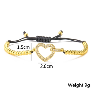 Detail view showing heart-shaped 18K gold plated zircon charm measurements and weight 9g
