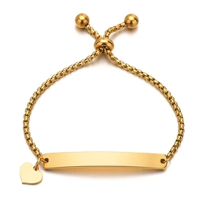 Detail of adjustable gold box chain bracelet with heart charm and engravable curved bar