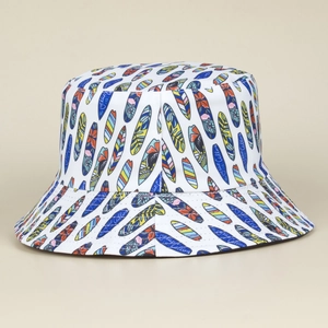 Close-up of vibrant surfboard print and Ocean Calling text on white bucket hat