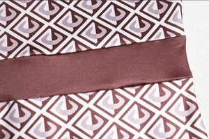 Detailed macro view of geometric print pattern and high-quality stitching on fabric