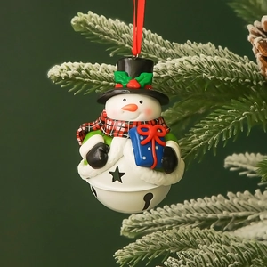 Festive Christmas snowman bell ornament with red ribbon gifts on snowy tree branch