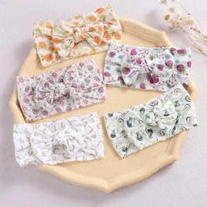 Detailed set of 5 soft baby headbands featuring colorful fruit prints and cute bows
