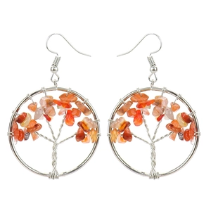Close-up of handmade tree of life earrings with silver wire and orange crystal beads
