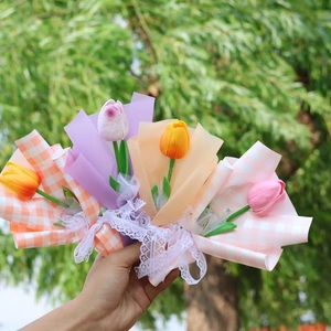 Handheld artificial tulip bouquets in mixed colors with decorative lace ribbons