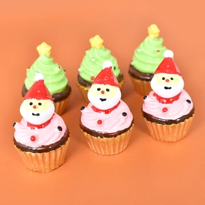 Set of six resin Christmas ornaments featuring Santa Claus and green holiday trees