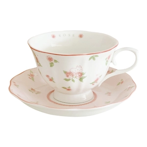 Vintage ceramic coffee cup and saucer set with pink rabbit and rose floral patterns