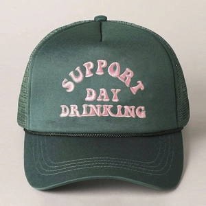Detail of green trucker hat with pink 3D embroidery and breathable mesh back