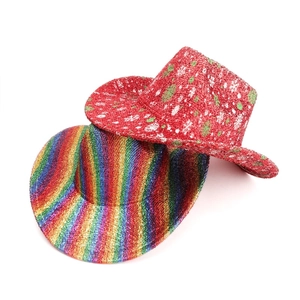 Detail of glittery Christmas hats featuring rainbow stripes and snowflake tree patterns