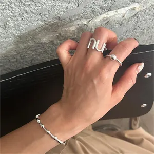 Minimalist S925 sterling silver jewelry set featuring U-shaped ring and fluid link bracelet