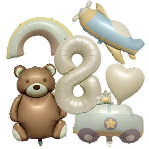 Detail of 40-inch cream number 8 balloon with brown bear and blue airplane party set