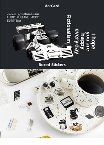 Detailed close-up of retro black and white decorative stickers on a ceramic tray