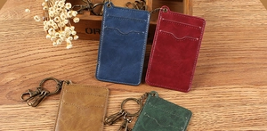 Detailed close-up of retro leather card holders with lychee texture and bronze hardware