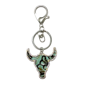 Western bull head keychain with leather texture and colorful rhinestones on white background