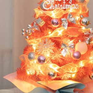 Detail of 55cm mini Christmas tree with ornaments, glowing lights, and a Merry Christmas sign