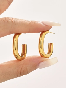 Close-up of dual-layer C-shaped 18k gold-plated stainless steel hoop earrings