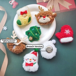 Plush Christmas brooches featuring snowman and reindeer shapes in soft teddy fleece material