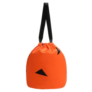 Close-up of orange Halloween pumpkin drawstring bag with satin texture and black straps
